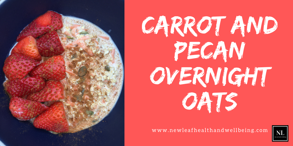bowl with carrot and pecan overnight oats and strawberries