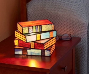 photo of a lamp that lookls like books